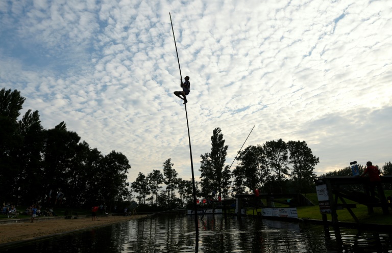 Dutch canal-leaping pole vaulters aim for the sky